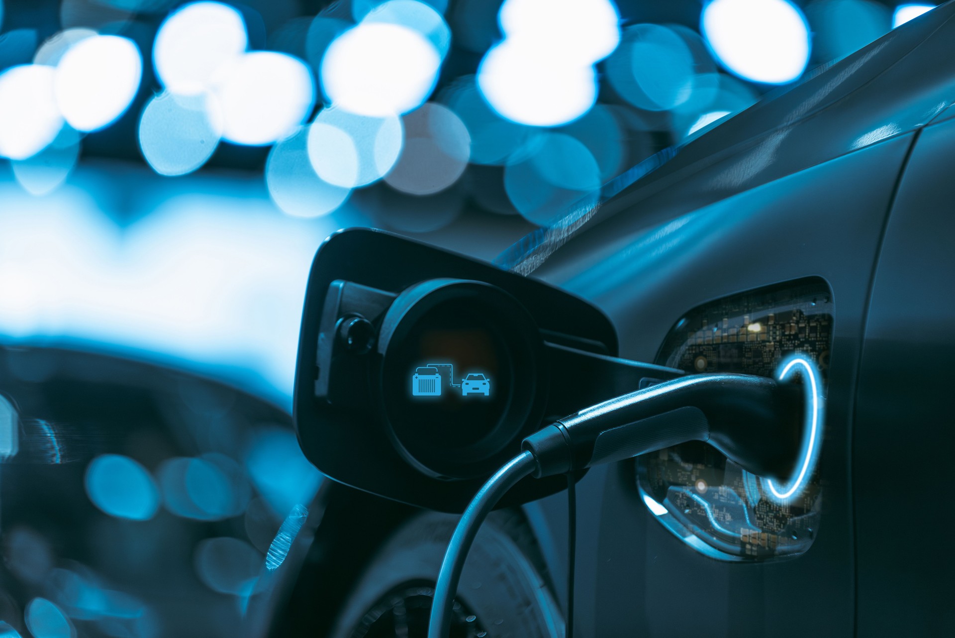 Electric car charging at station with futuristic lighting